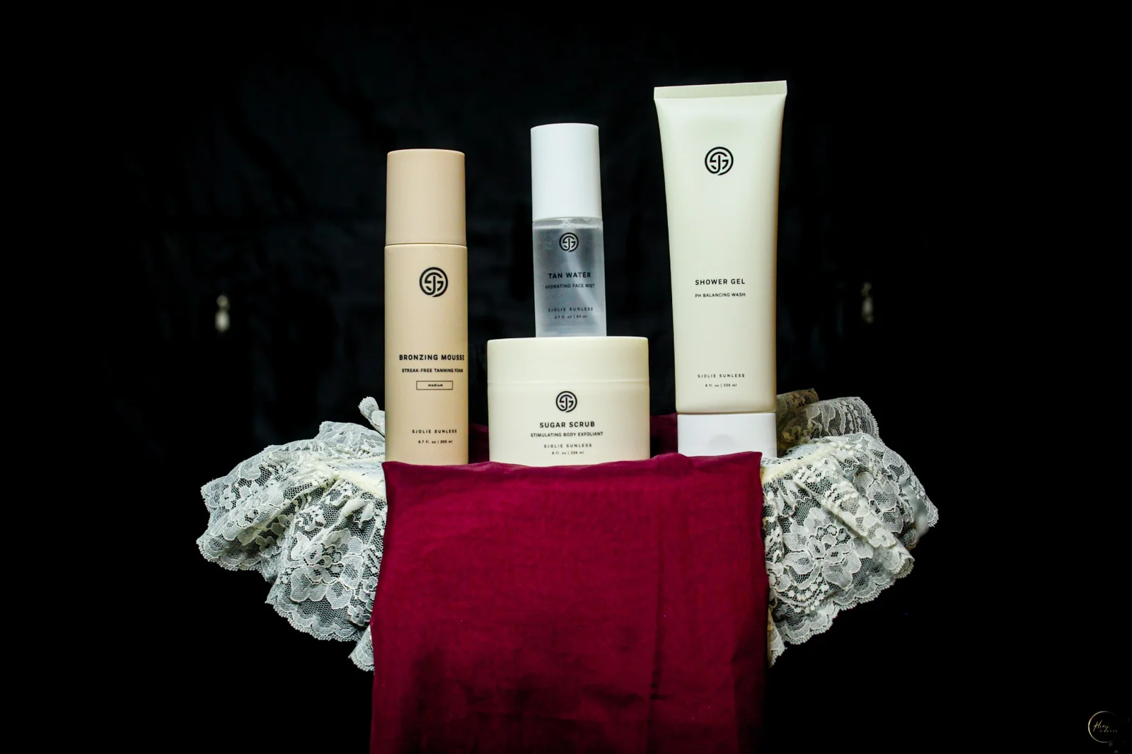 Bronzing mousse, tan water, sugar scrub and shower gel